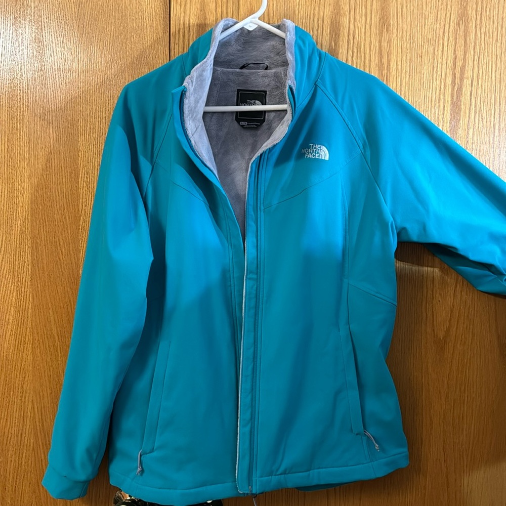 North Face women’s jacket- fleece lined dark aqua blue, worn a few times.